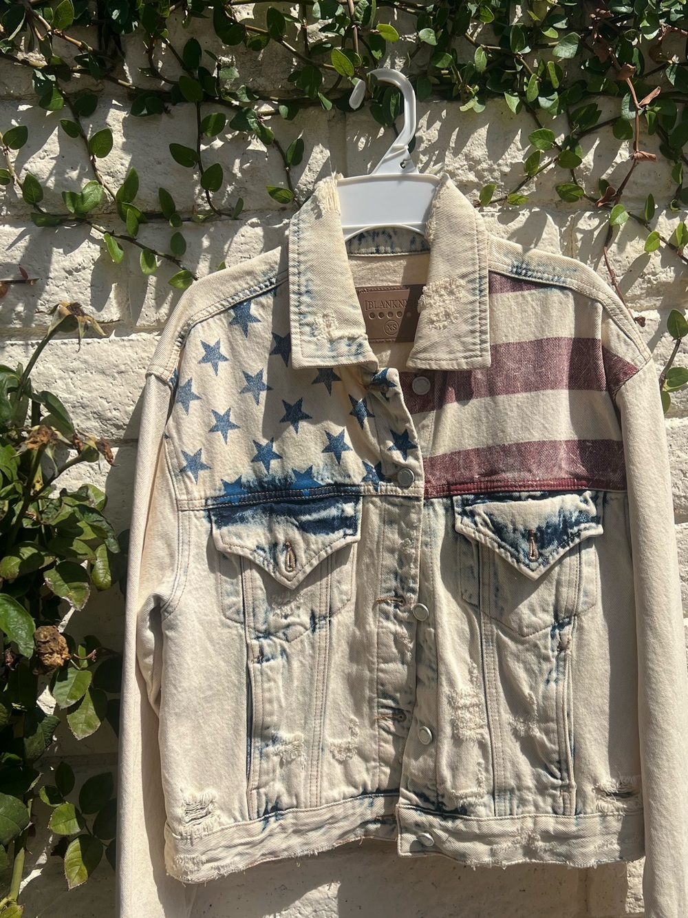 Blank NYC Cream Denim Jacket with Red & Blue Flag Print